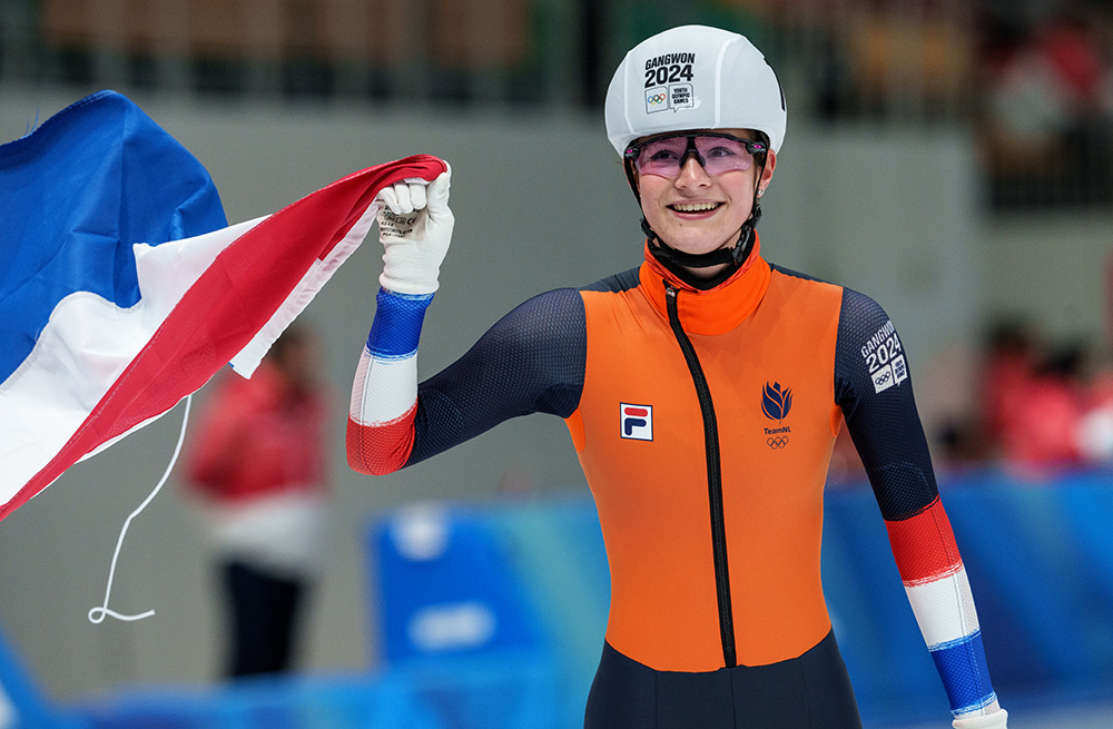 Angel Daleman (NED) celebrates with the Dutch flag after finishing first in the Speed Skating Women’s Mass Start Final at the Gangneung Oval