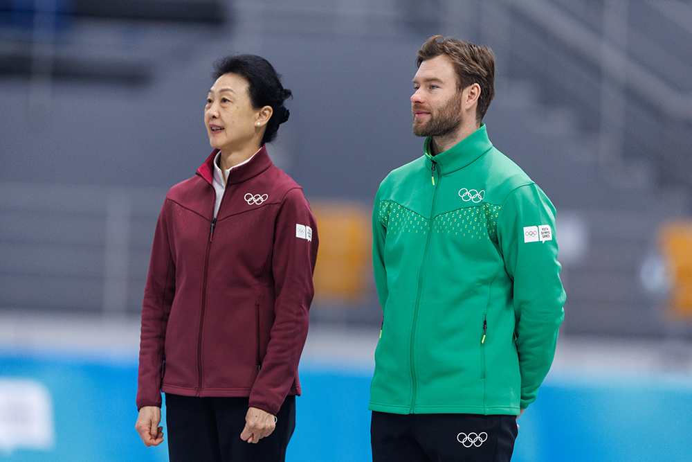 Athlete Role Model Haralds Silovs (LAT), in green, at the medal ceremony of the Speed Skating Men’s 1500m at the Gangneung Oval