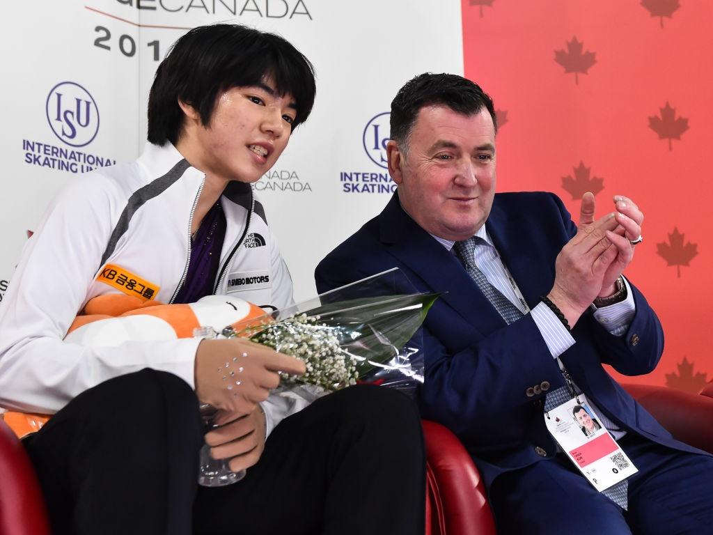 Junhwan Cha (KOR) and coach Brian Orser GPFS CAN 2018©International Skating Union (ISU) 1054396048