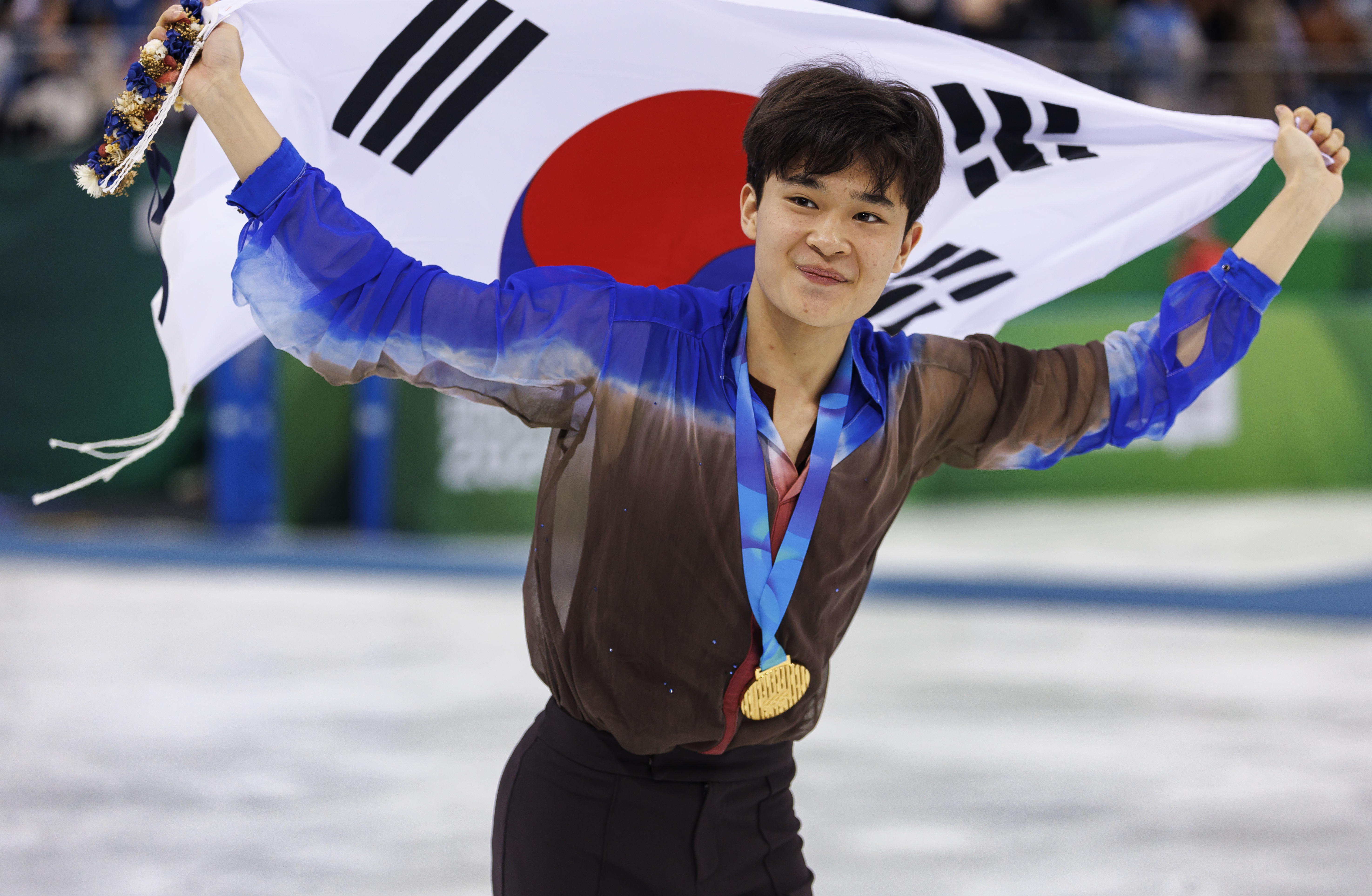 Gold medalist Kim Hyungyeom (KOR) celebrates at the Gangneung Ice Arena on Monday