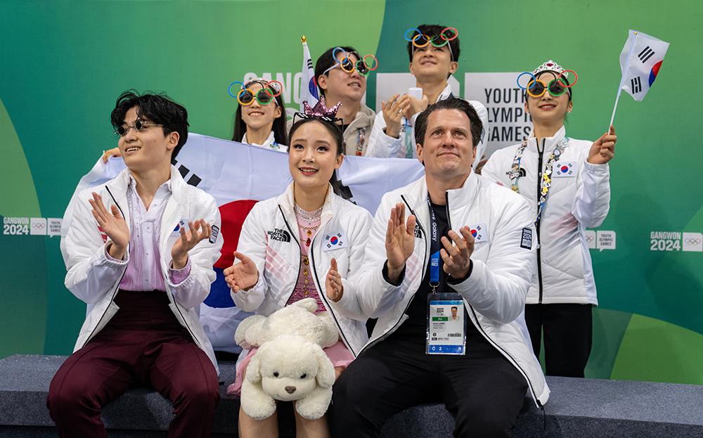 Ice dancers Kim Jinny (KOR) and Lee Namu (KOR) react to their score in the Kiss and Cry following their performance in the Team Event