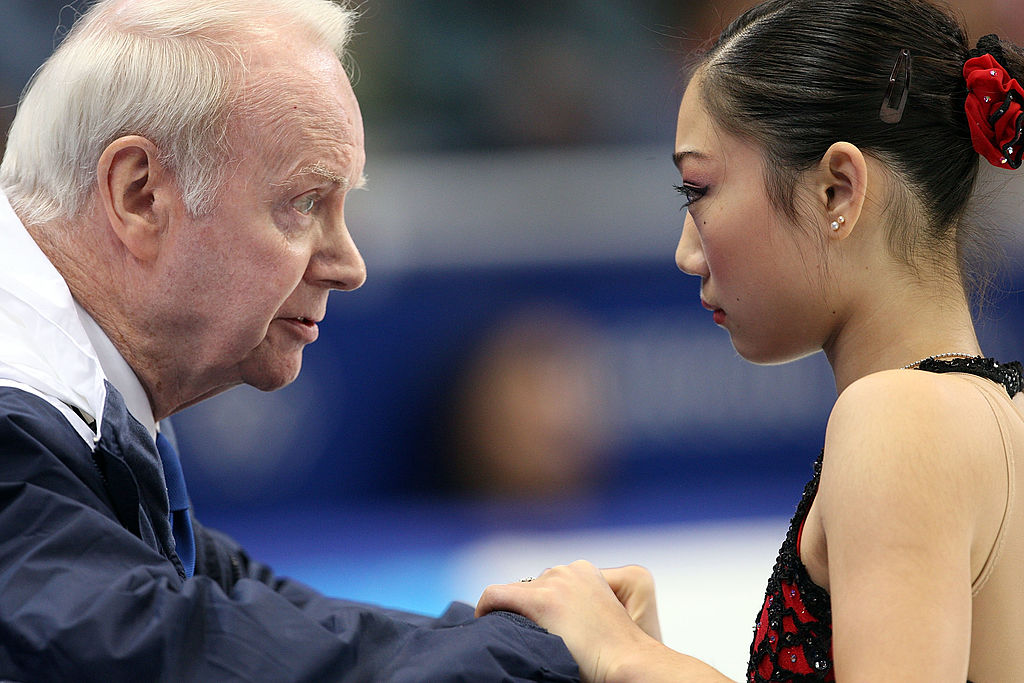 Mirai Nagasu (USA) with coach Frank Carroll 2010 Vancouver Winter Olympics Vancouver (CAN) GettyImages 97081594