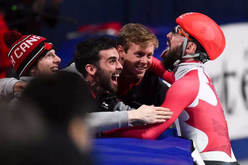 Charles Hamelin of Canada celebrates with brother Francois Hamelin and Pascal Dion WSTSSC 2018©International Skating Union (ISU) 933726230