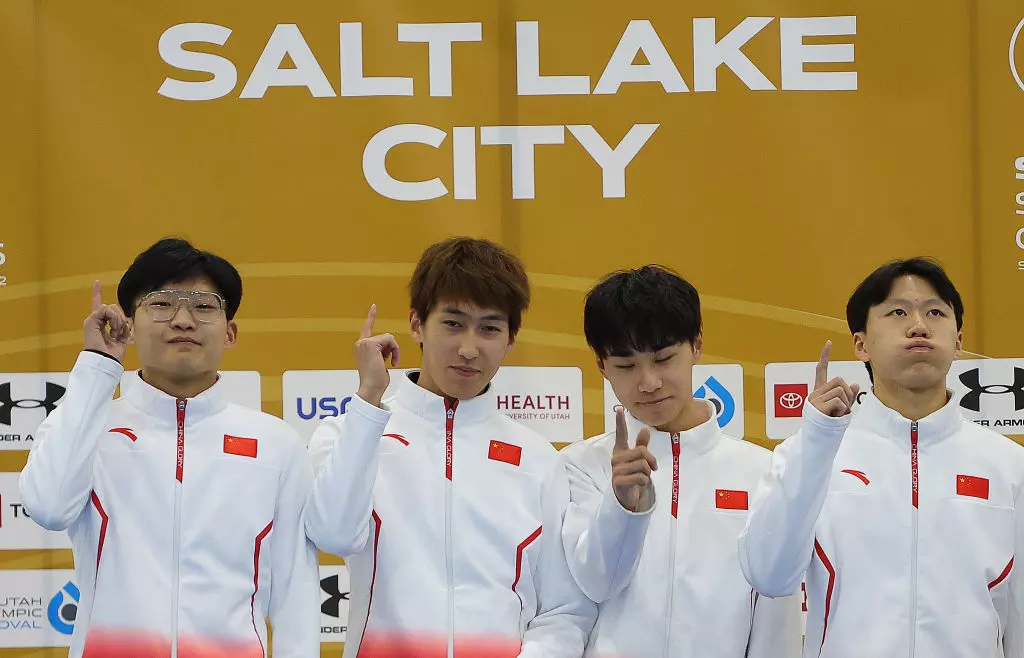 China celebrate gold in the 5000m Men's Relay