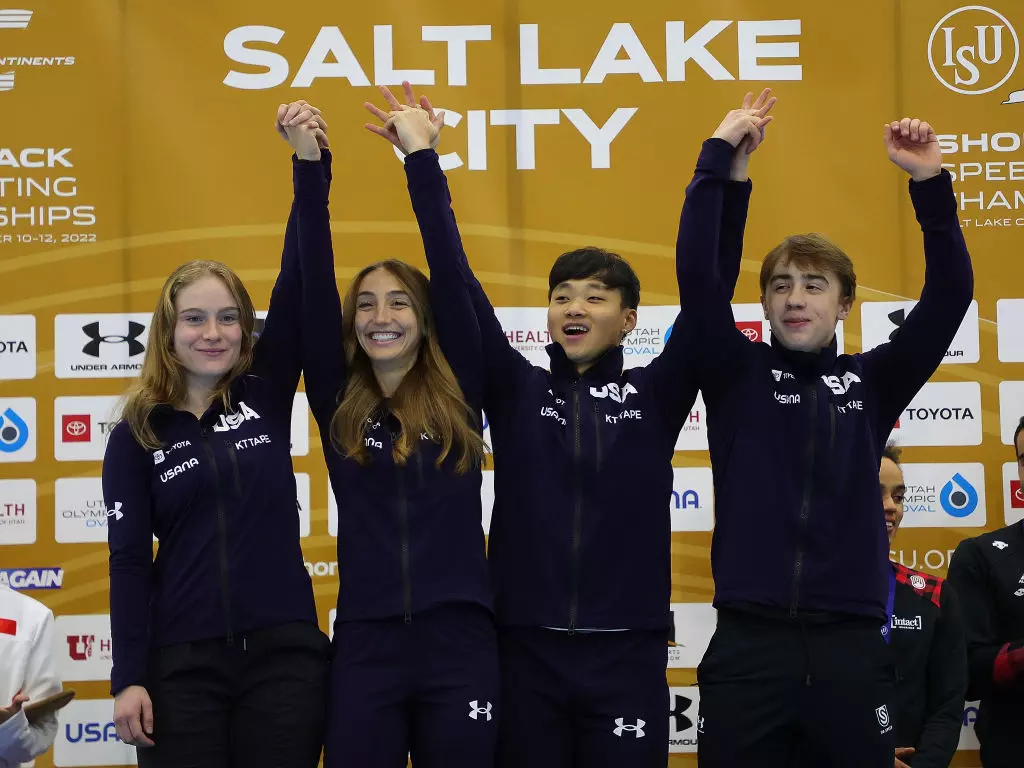 The USA team celebrate victory in the mixed relay
